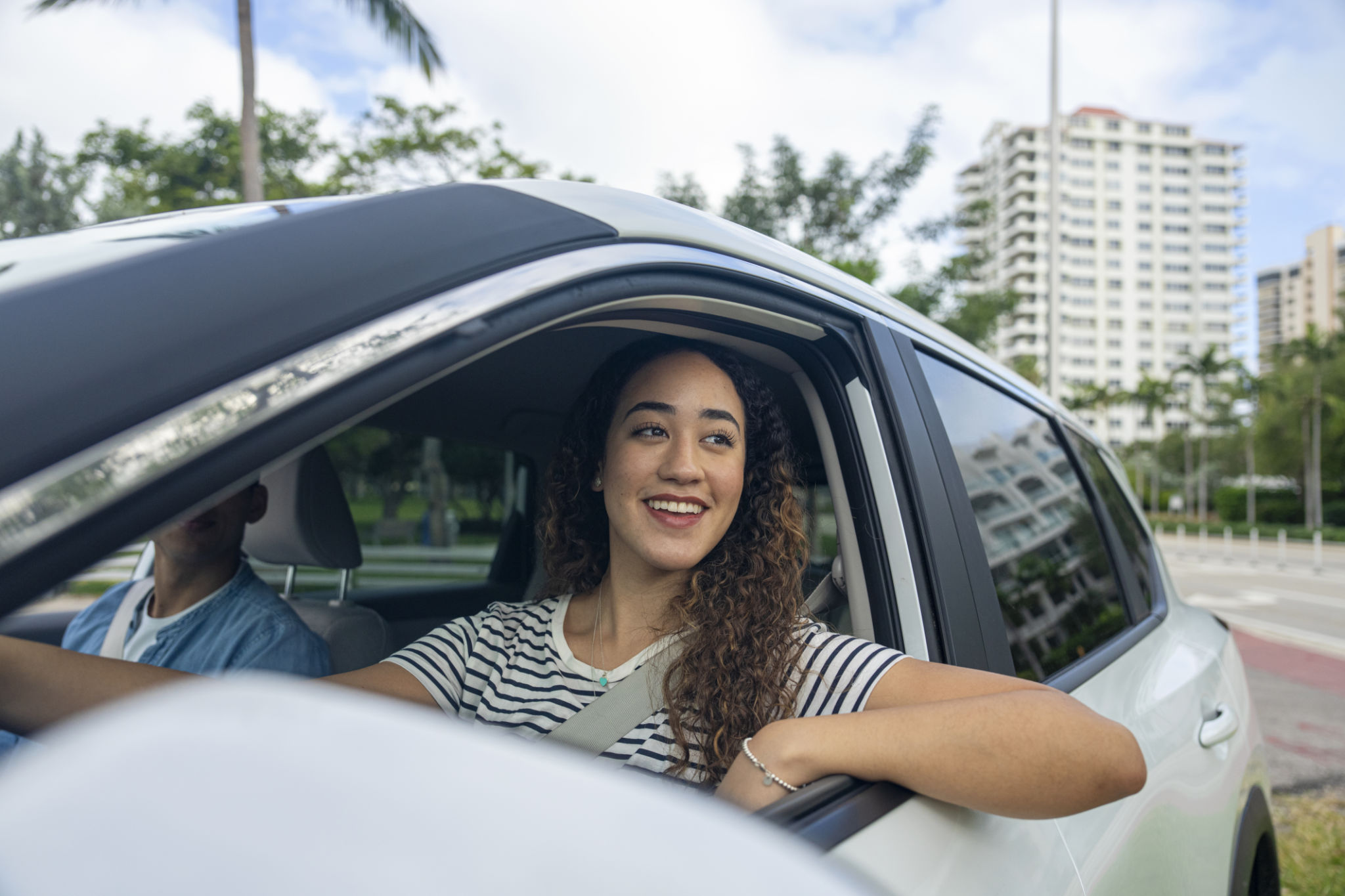 Woman smiling in car's driver's seat